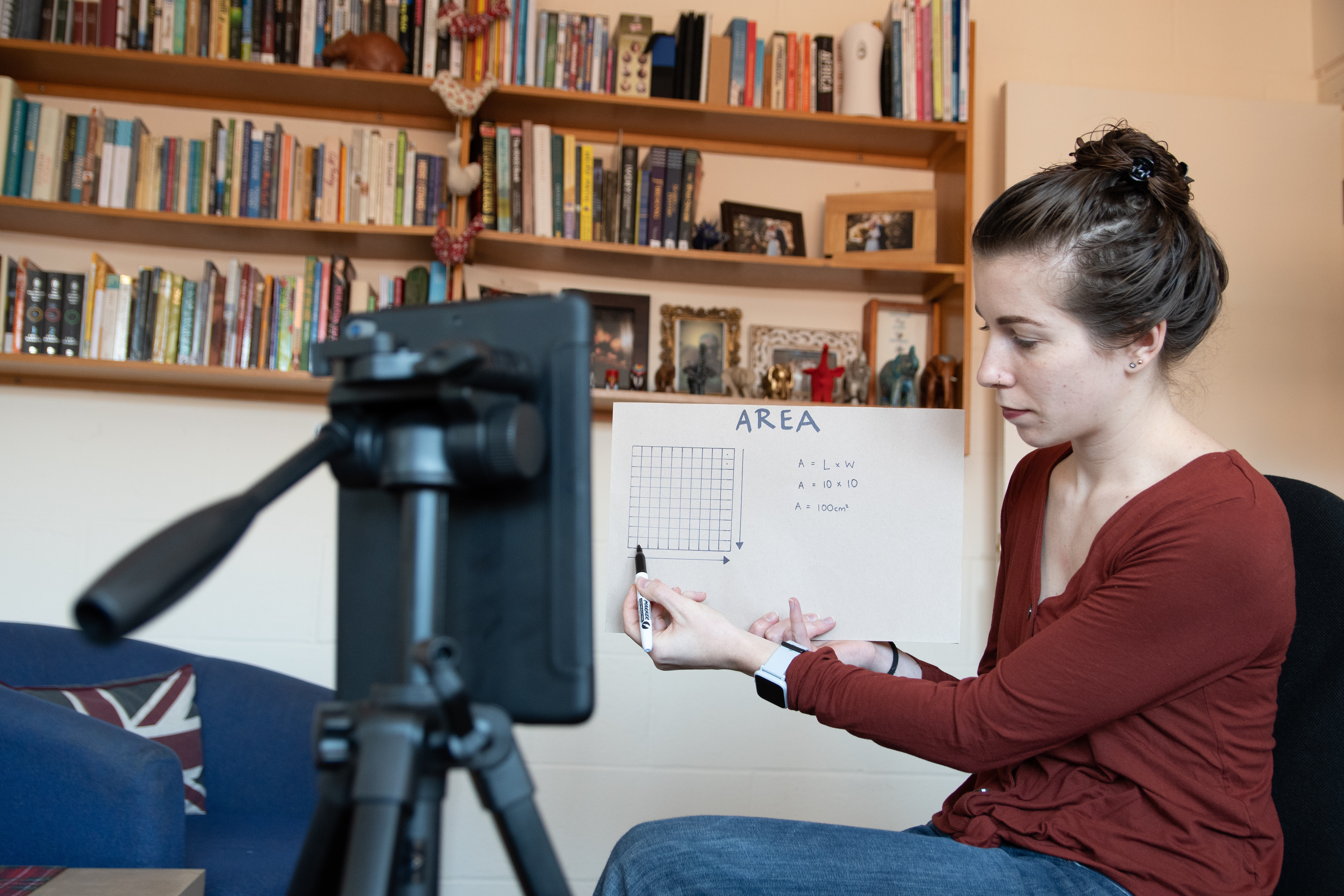 teach holding virtual lesson with ipad and graph